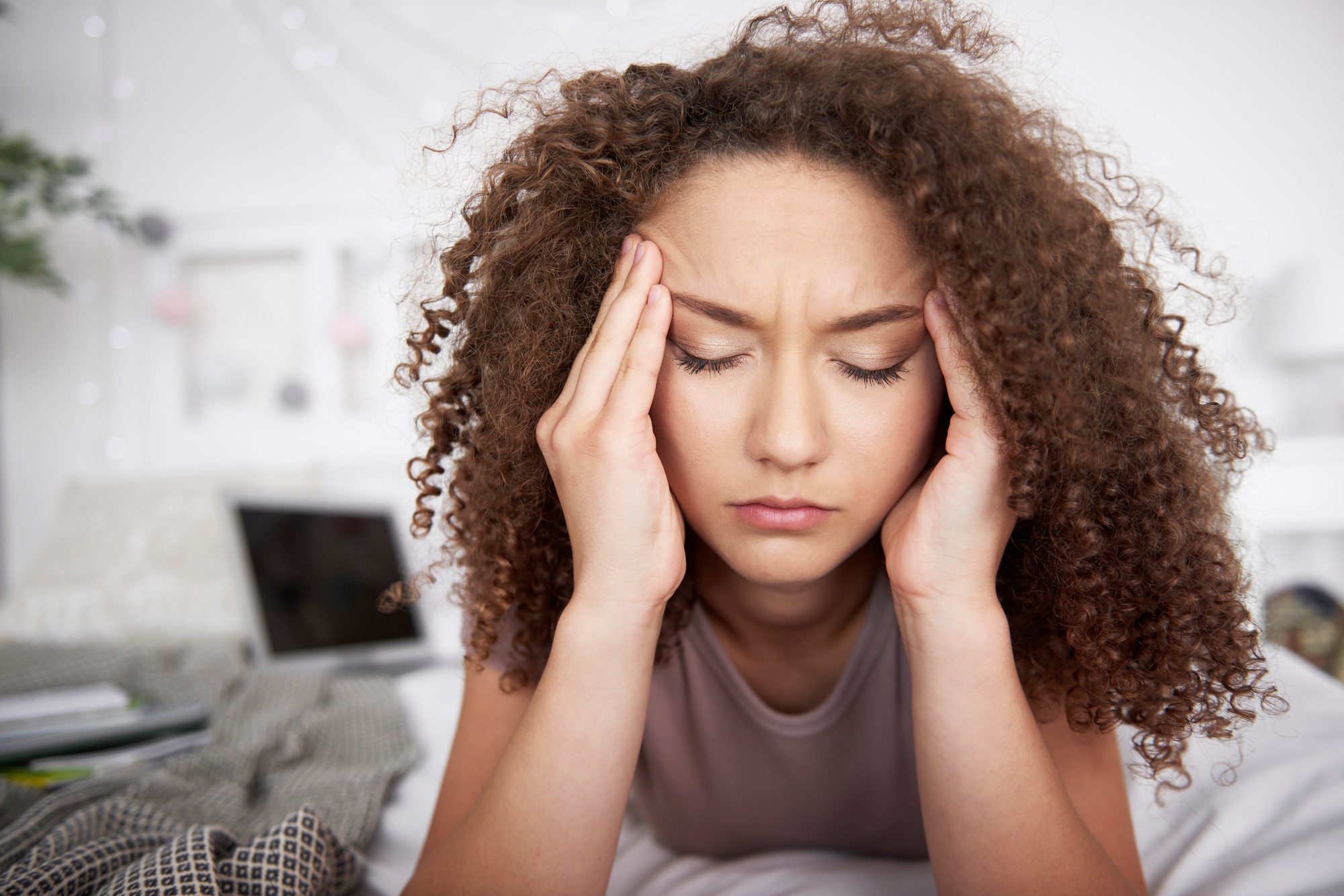 Young woman has a bad head